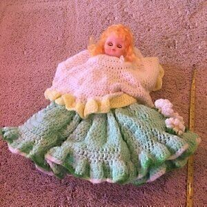 Vintage doll in  hand crocheted dress